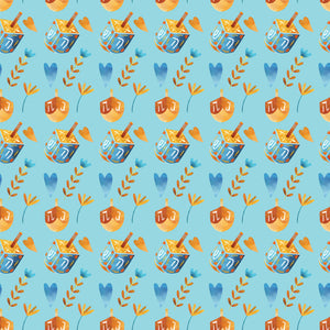 Blue wrapping paper with blue and orange Dreidels and blue and orange hearts